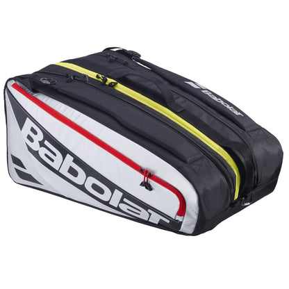 The Babolat RH Pro Padel Racket Bag in black and silver features a red zipper pocket, two yellow compartments—including an insulated racket section—and black handles with the Babolat logo on the side.