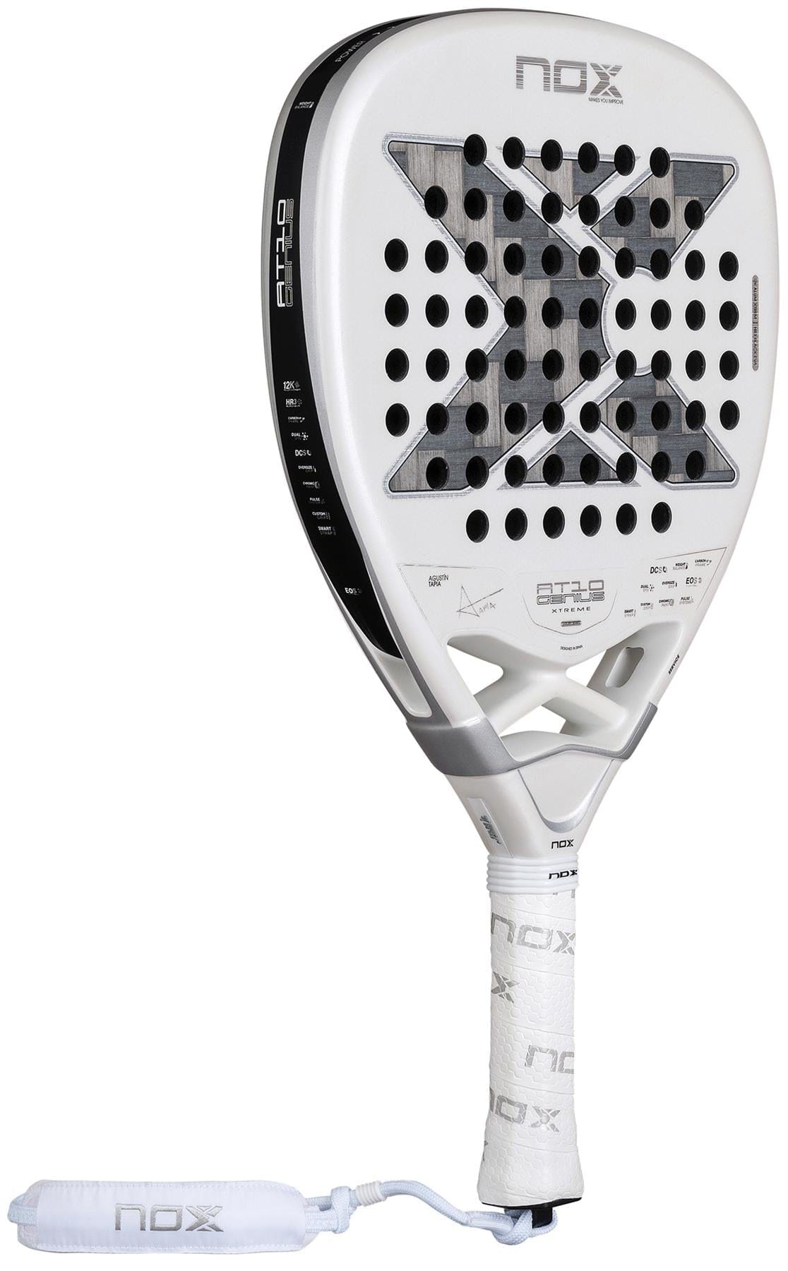 The NOX AT10 Genius Attack 12K Alum Extrem By Agustín Tapia 2026 Padel Racket features a white design, bold black "X" on the face, round holes, a white grip handle, and a wrist strap with the NOX logo for ultimate power on court.