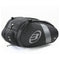 The Bullpadel Neuron 25 Padel Racket Bag is a black motorcycle tail bag with silver accents and a logo on the side, featuring multiple zippered compartments and an aerodynamic design, set against a plain white background.