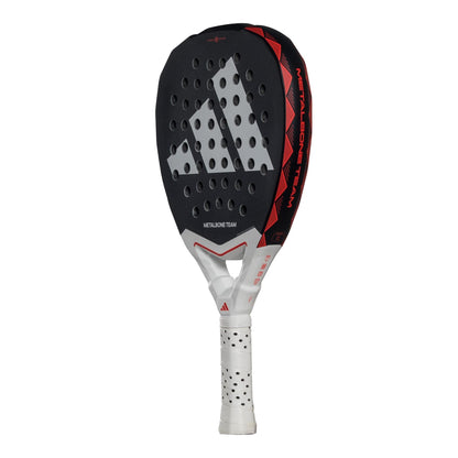 The adidas Metalbone Team 3.4 Padel Racket features a black, red, and white design with perforated holes, "METALBONE TEAM" branding, and a white handle with black grip dots—perfect for aggressive court play.