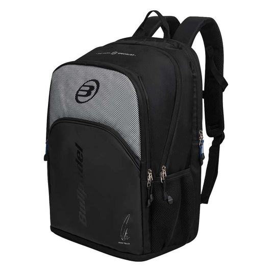 The Bullpadel BPM26007 Vertex Padel Backpack in black features multiple zippered compartments, mesh side pockets, padded shoulder straps, and a front logo—perfect as a stylish padel racket bag inspired by Bea González.