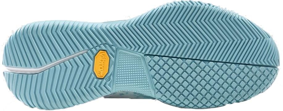 The Bullpadel Pearl Vibram 26V Women's Padel Shoes in Sky Blue feature a light blue Vibram outsole with angled grooves, a diamond center pattern, and a yellow logo by the arch—designed for traction and flexibility on the padel court.