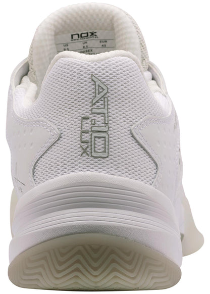 A close-up rear view of the NOX AT10 Lux Mens Padel Shoes - White / Grey, featuring "AT10 LUX" embroidered in gray on the heel, a textured midsole, and a white patterned sole. Brand: NOX.