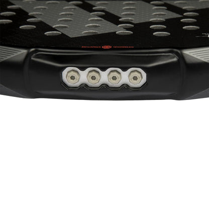 Close-up of the bottom edge of the adidas ADIDAS Metalbone 3.4 Padel Racket, revealing four screw heads in a row and part of its black, textured surface with circular holes.