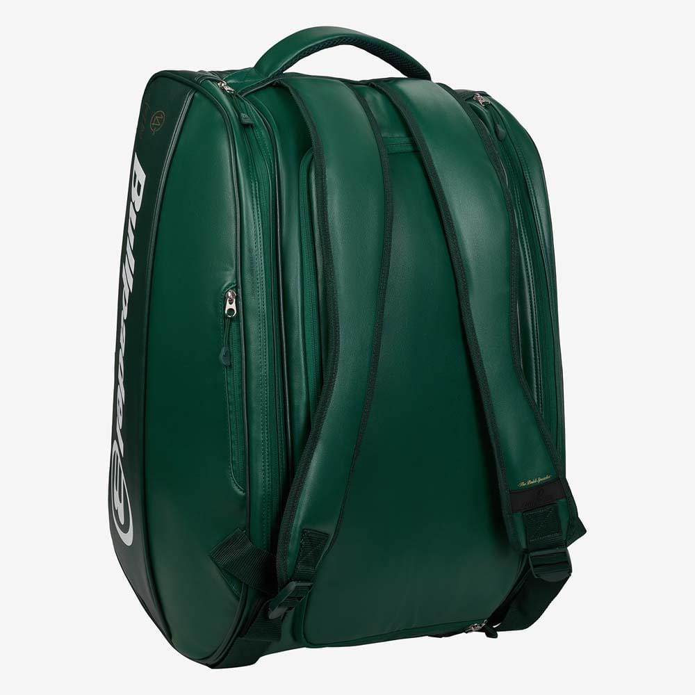The Bullpadel BPP26023 Icon Padel Racket Bag in green features black straps, a top handle, the white "Bullpadel" logo on the side, multiple zippered compartments, and a sleek design inspired by Juan Martín Díaz.
