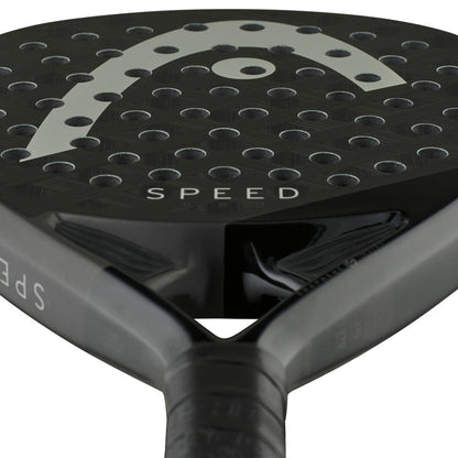 Close-up of the HEAD Speed Pro 2025 Padel Racket showing "SPEED" on its surface, round holes, a curved white detail, and a partially visible handle. Enhanced with Power Foam and Auxetic 2.0 technology for superior performance.