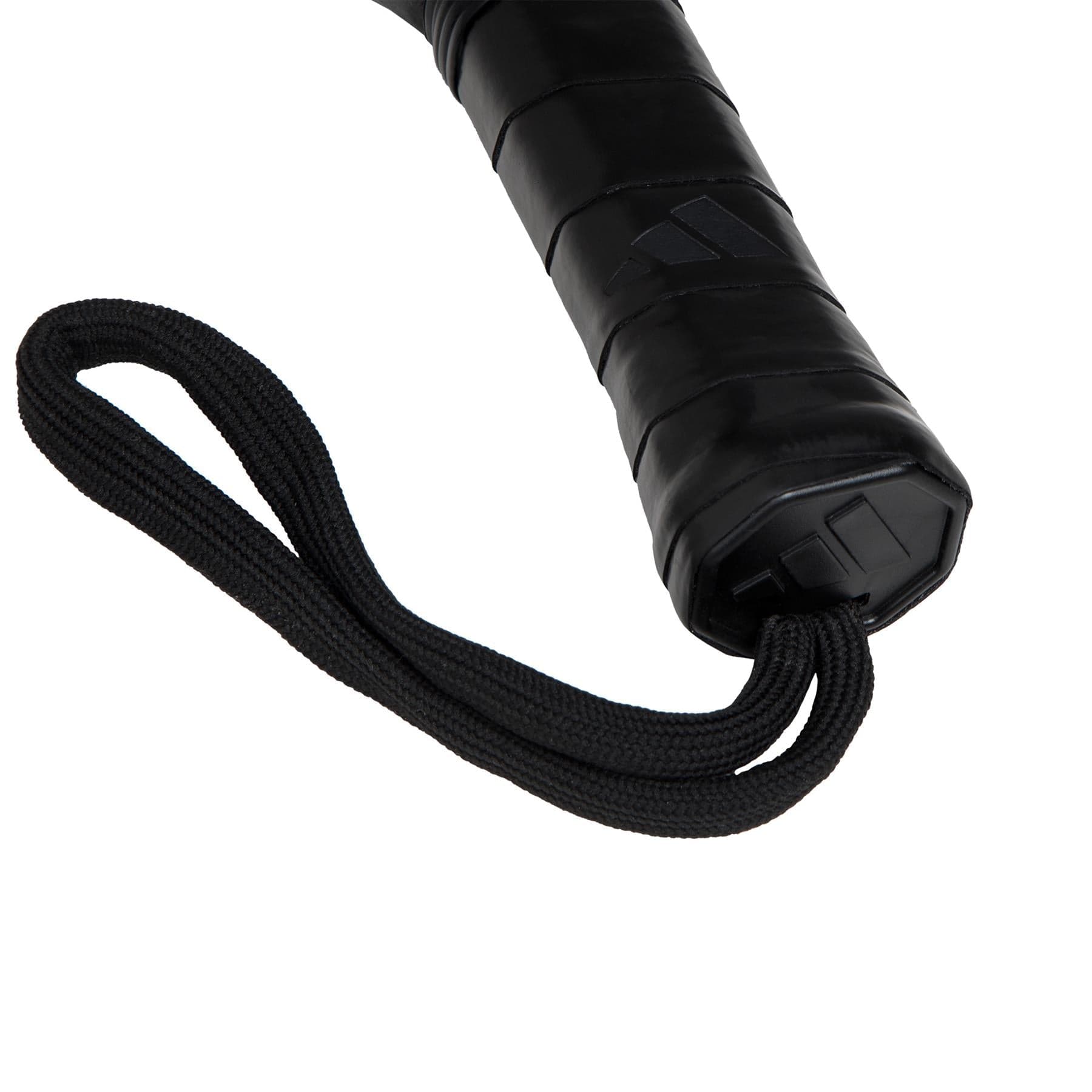 Close-up of the adidas Match Blue 3.4 Padel Racket handle featuring a textured grip, Smart Holes Lineal design, and a black wrist strap, displayed against a white background.