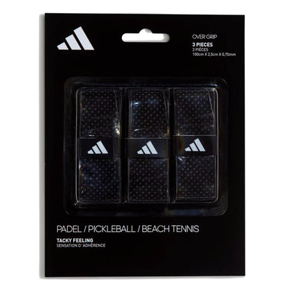The adidas Padel Overgrips (3 Pack) - Black come in a black pack with clear plastic showing the grips, white adidas logo, and micro-perforations for comfort and performance in padel, pickleball, or beach tennis.
