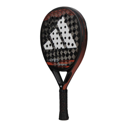 The adidas Cross It CTRL Padel Racket features a black base with red and white geometric details, the adidas logo on the face, and a perforated surface—designed for players seeking control in their game.