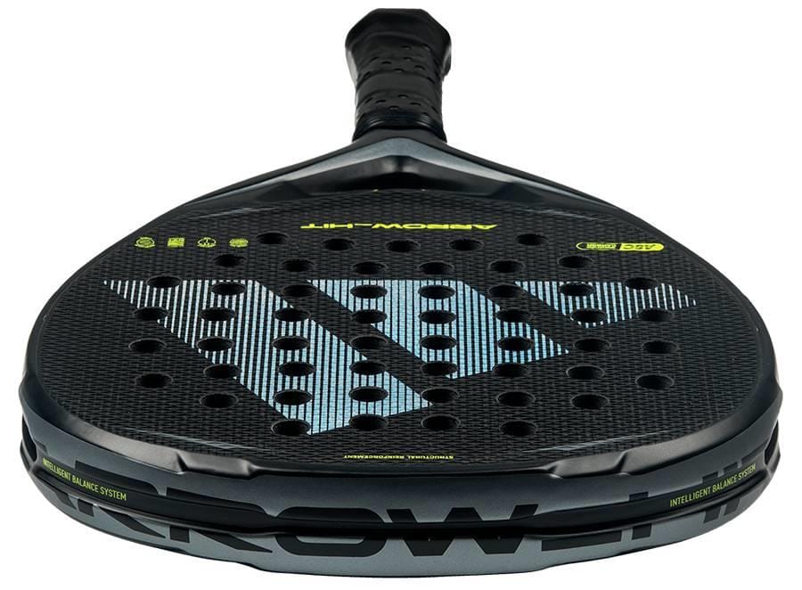 A close-up of the adidas Arrow Hit 2026 Padel Racket showcases its honeycomb pattern, large silver "D" logo, intelligent balance system for powerful play, black grip tape, and striking green text accents in a sleek design.