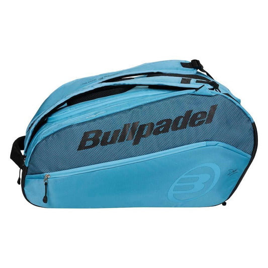 The Bullpadel BPP26003 Vertex W Padel Racket Bag in light blue features black zippers, straps, and branded detailing—ideal for carrying your padel equipment.