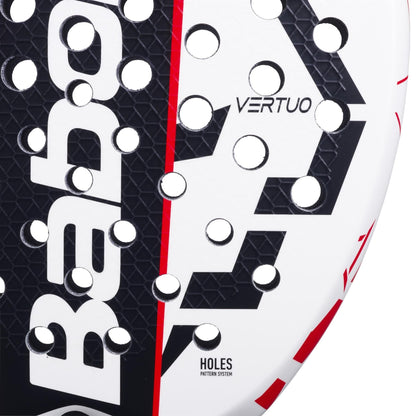 Close-up of the Babolat Technical Vertuo Juan Lebrón Padel Racket in white, black, and red, showing "VERTUO," "HOLES PATTERN SYSTEM," and the Babolat logo—a technical striker racket inspired by Juan Lebrón.