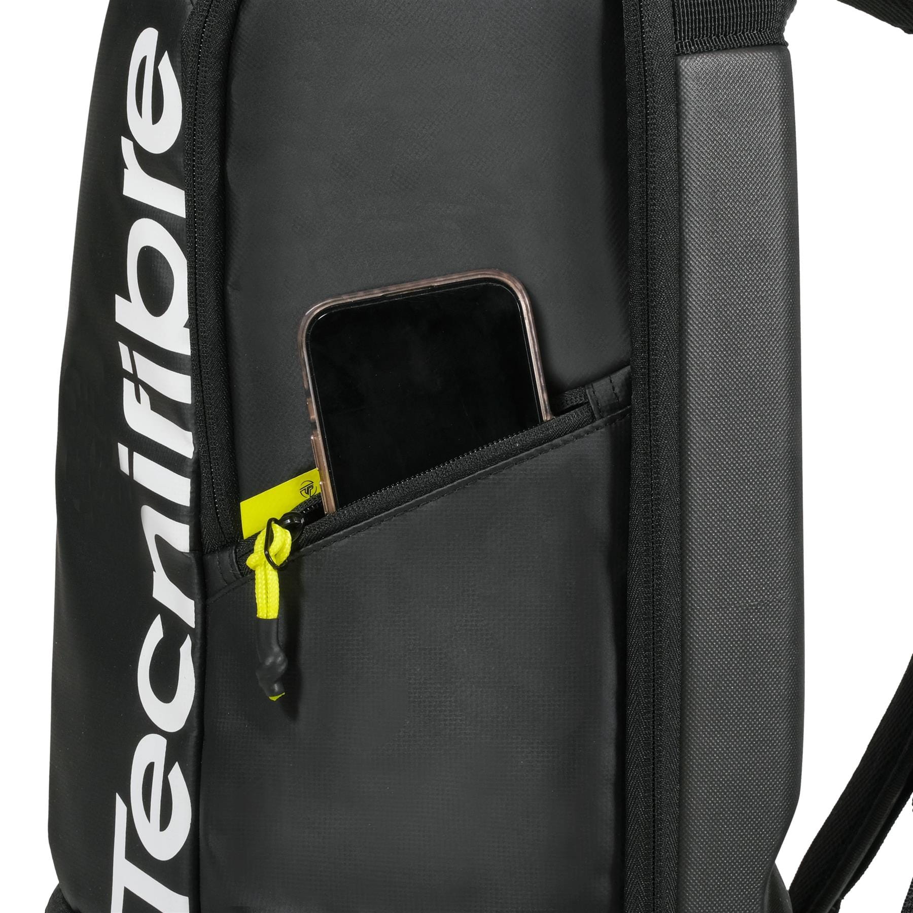 A close-up of the black Tecnifibre Reform Padel Backpack shows a partially unzipped side pocket with a smartphone inside and a yellow zipper pull, highlighting this Tecnifibre backpack’s sleek design and durable EVA material.