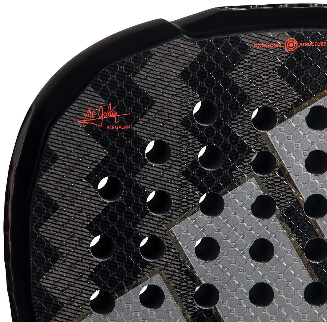 Close-up of the adidas Metalbone by Ale Galán 2026 Padel Racket face, featuring circular holes, a geometric texture, and the red "Ale Galán" signature highlighting the Spin Blade Decal for added spin.