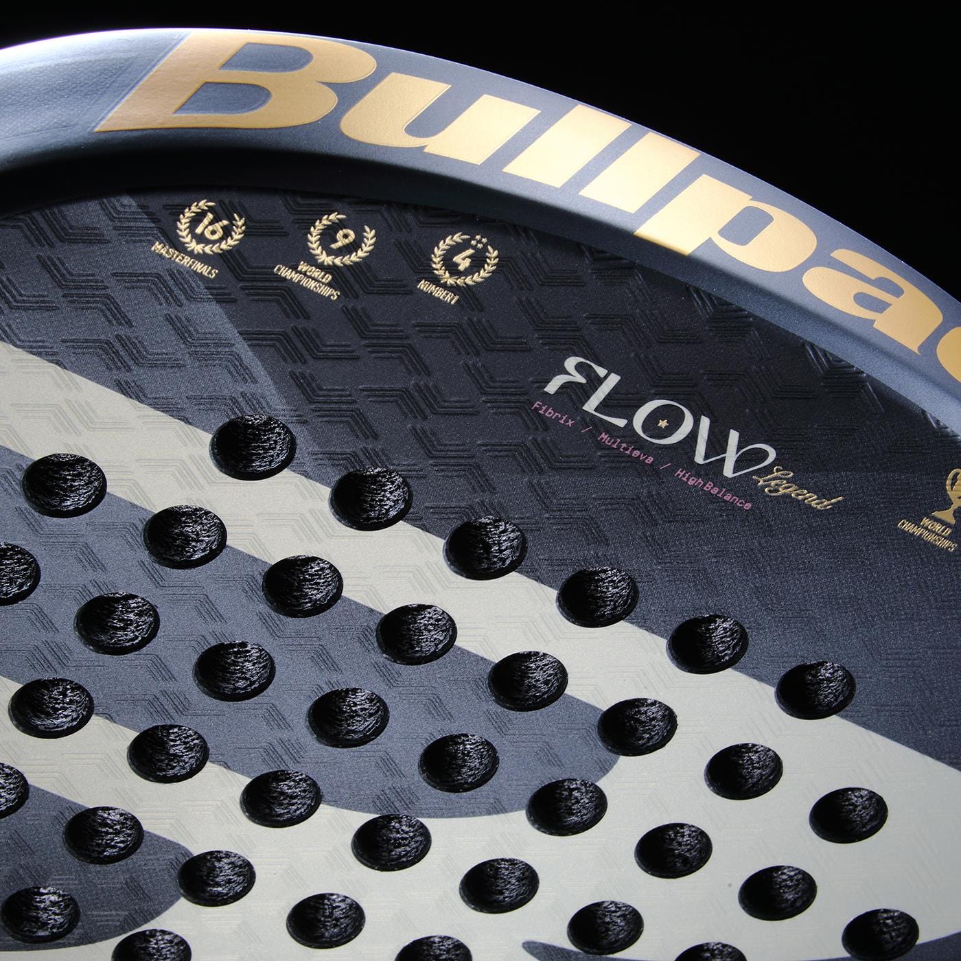 Close-up of the Bullpadel Flow Legend 2026 Padel Racket: black and gray design with circular holes, gold Bullpadel branding, award icons, a textured surface, and advanced Flowforce technology in this premium women’s padel racket.