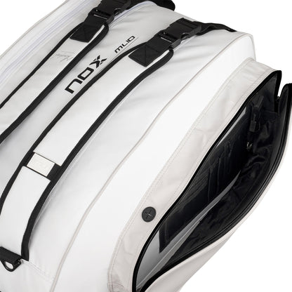 Close-up of the NOX ML10 Team Padel Racket Bag in white/grey by NOX, featuring zippered compartments, adjustable straps, an open side pocket with organizing slots, and black lining—ideal for storing your padel gear.