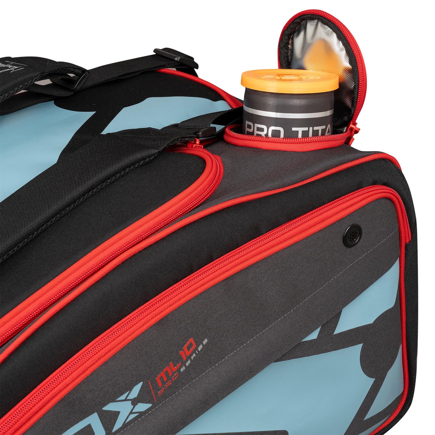 A close-up of the NOX ML10 Competition XL Compact Padel Racket Bag - Black / Red shows its black and red panels. A PRO TITAN can is partially visible in an open side pocket. Brand: NOX.