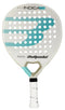 The Bullpadel Indiga W 2025 Padel Racket for women features a white design with turquoise accents, circular holes, the Bullpadel and model names on the face, and a white grip handle.
