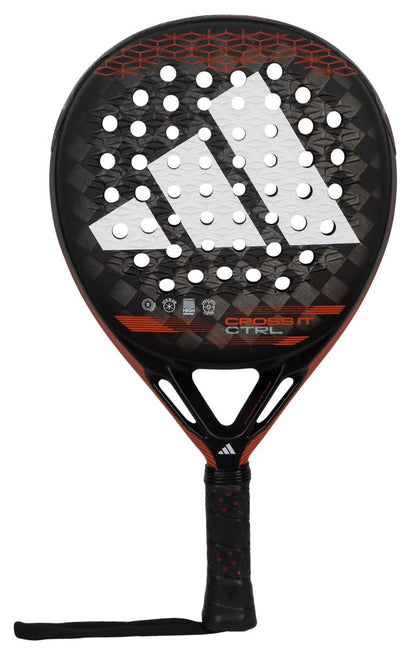 The adidas Cross It CTRL Padel Racket features a black design with a large white logo, circular holes, red accents, and wrist strap. “Cross It CTRL” appears at the center—ideal for players seeking control on the court.
