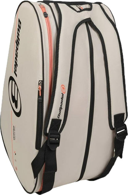 The Bullpadel BPP26015 Tour 2026 Padel Racket Bag in white features black straps and edging, an orange zipper, the Bullpadel logo on the side, spacious storage with shoulder straps, and thermal racket compartments for your gear.