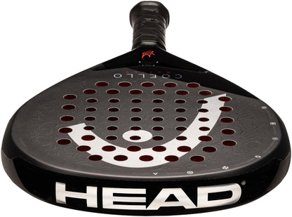 The HEAD Coello Motion 2025 Padel Racket by HEAD is black with red circular holes, a white logo on the face, and a handle wrapped in black grip tape. It features Auxetic 2.0 technology and is shown from the front.