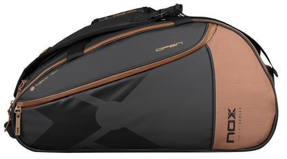 The NOX Luxury Open Series Padel Racket Bag in black and brown features multiple compartments, advanced ThermoTech technology, and "NOX Luxury Series" branding—perfect for stylish padel players.