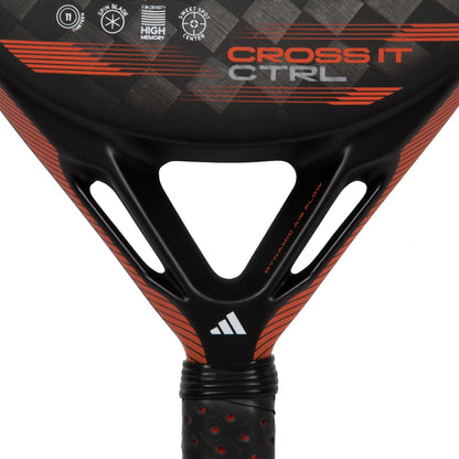 Close-up of the adidas Cross It CTRL Padel Racket, a high-control racket displaying "CROSS IT CTRL" text, adidas logo, technical specs at the frame's top, and a textured grip with small perforations.