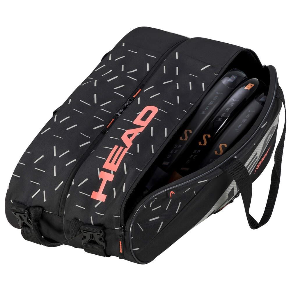 The HEAD Team Padel Bag L - BKCC is a lightweight tennis bag featuring a black design with white and orange geometric patterns, prominently displaying the word "HEAD" in bold orange letters. The bag is partially open, showing several tennis rackets within its racket compartments, and includes a convenient side handle.