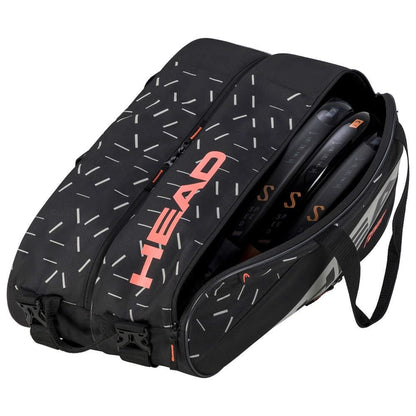 The HEAD Team Padel Bag L - BKCC is a lightweight tennis bag featuring a black design with white and orange geometric patterns, prominently displaying the word "HEAD" in bold orange letters. The bag is partially open, showing several tennis rackets within its racket compartments, and includes a convenient side handle.