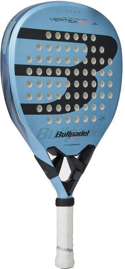The Bullpadel Vertex Junior Girls 2026 Padel Racket features a blue design, white grip, black-and-white circular holes, and a sleek black face.