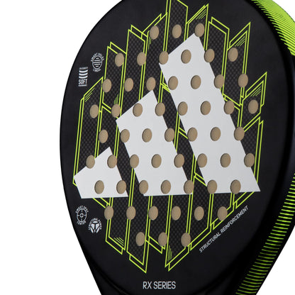 Close-up of the adidas RX Series Lime Padel Racket, featuring a geometric design, perforations, and “RX SERIES” plus “STRUCTURAL REINFORCEMENT” text—ideal for beginners and intermediate players.