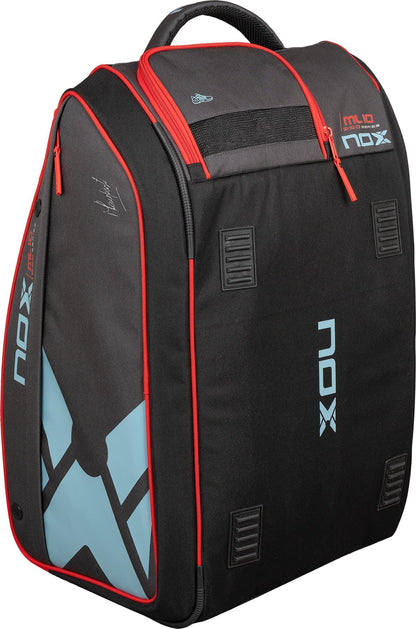 The NOX ML10 Competition XL Compact Padel Racket Bag—Black/Red—combines modern style with spacious compartments, blue geometric accents, red zippers, and bold NOX branding; ideal for carrying your padel gear.