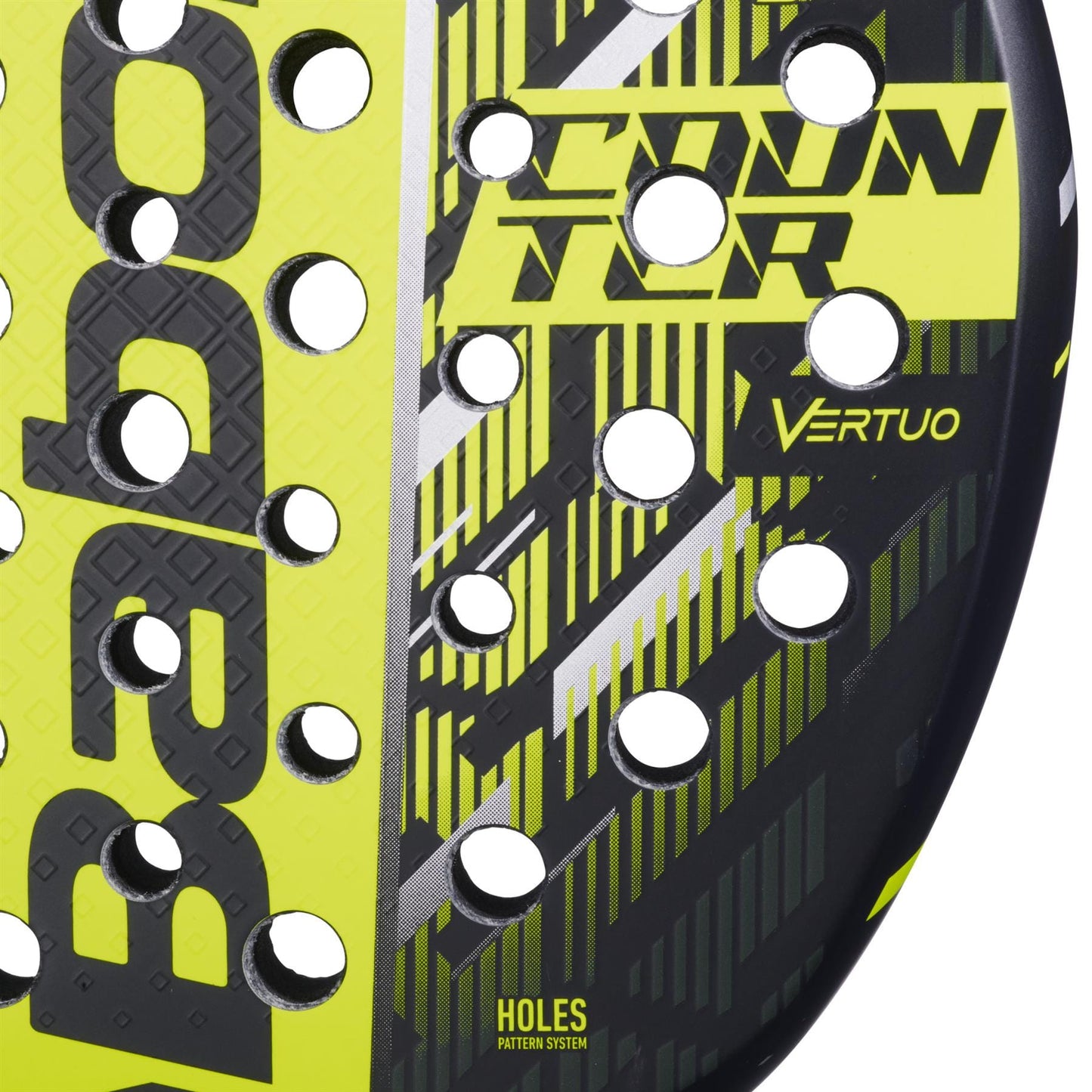 Close-up of the Babolat Counter Vertuo 2.5 Padel Racket with circular holes, showing "COUNTER VERTUO," "BABOLAT," and "HOLES PATTERN SYSTEM" on its surface for effortless power.