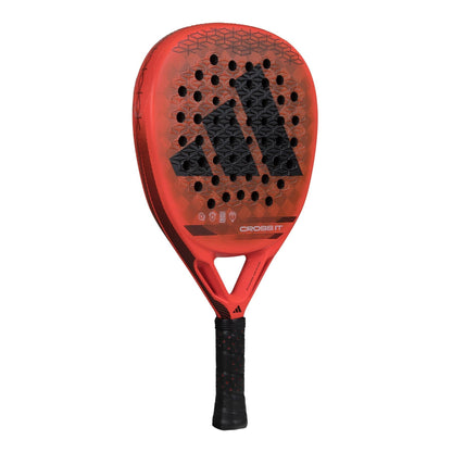 The adidas Cross It Padel Racket features a red, perforated face, black grip, and bold black adidas logo at the center—engineered for pros seeking top power and spin on the court.