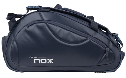 The NOX Pro Series Padel Racket Bag - Blue by NOX features a curved shape, multiple compartments, zippers, shoulder straps, and ThermoTech technology, shown against a white background.
