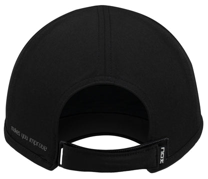 The NOX Padel Cap - Black / White by NOX features an adjustable fit with an open section above the strap, a small "NOX" tag, and "Makes you improve" printed on the left—combining style with sun protection.