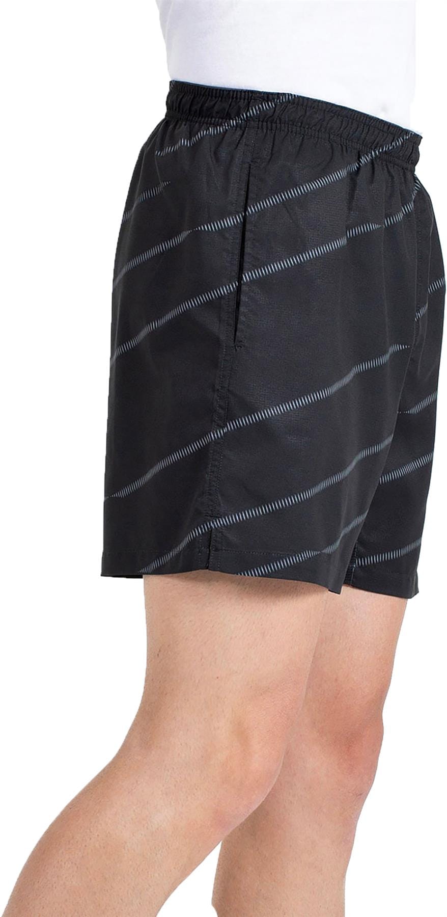 A person wears Bullpadel Cabanas Men's Padel Shorts in black, featuring thin diagonal white stripes, Quickerdry technology, an elastic waistband, and side pockets. The image is cropped to show only the lower torso and upper legs.