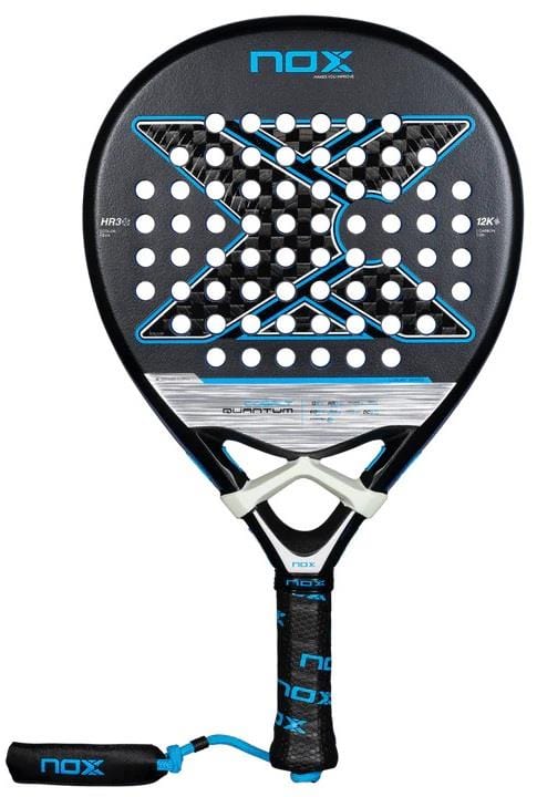 The NOX Luxury Quantum 12K Cobalt 2025 Padel Racket features a black and blue design with a large "X," perforated holes, padded handle, and wrist strap. Made of 12K carbon fibre, it displays the NOX brand at the top and on the strap.