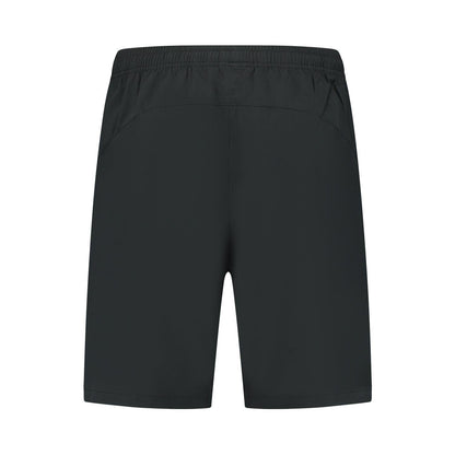 Back view of the plain black K-Swiss Hypercourt 7" Men's Padel Shorts, made from four-way stretch polyester with an elastic waistband. Logo-free and adaptable, they are designed for versatility and simplicity.