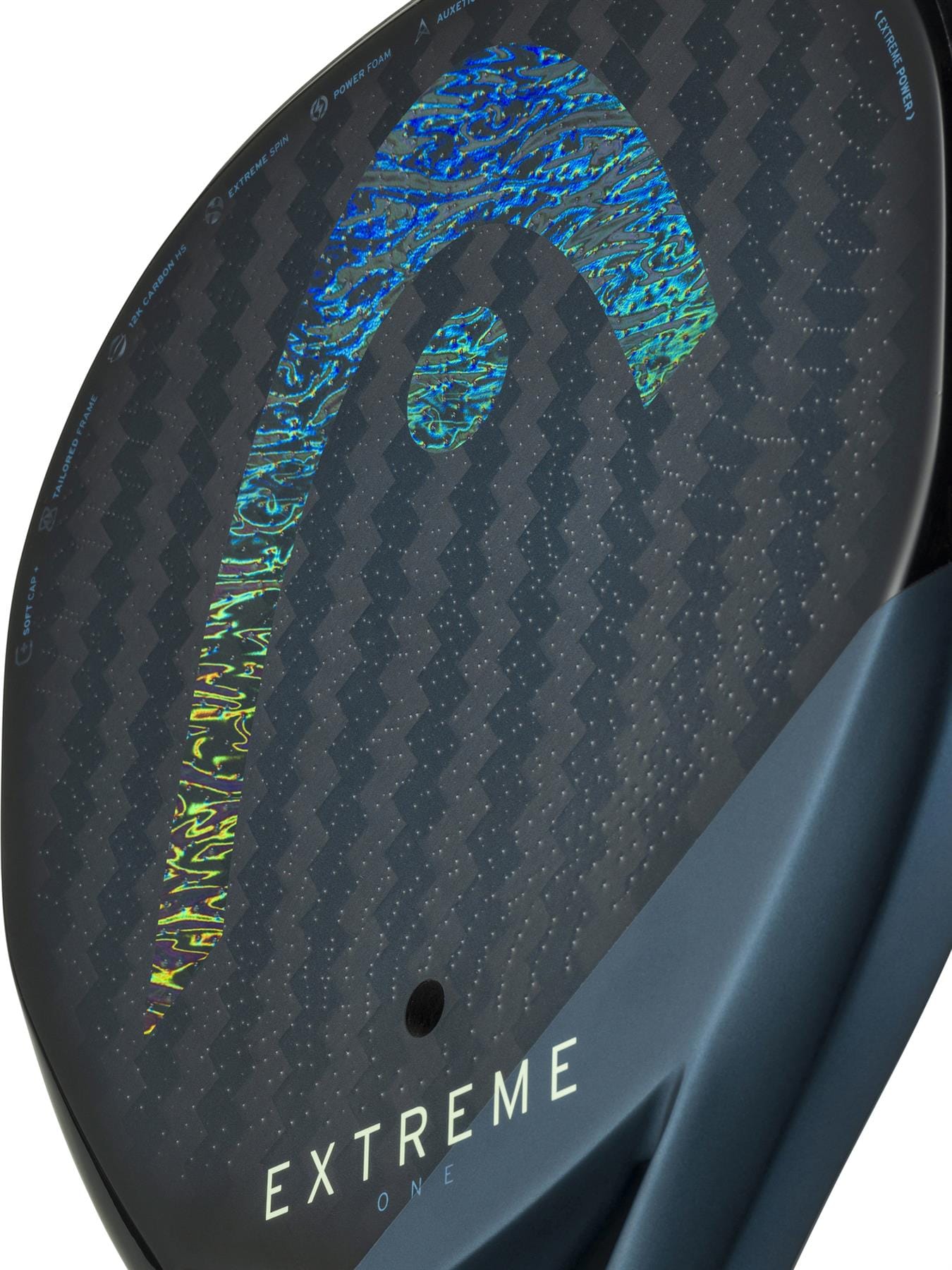 Close-up of the HEAD Extreme One 2025 Padel Racket showing a holographic HEAD logo, "Extreme One" at the base, and a textured 12K carbon fibre surface for improved Extreme Spin.