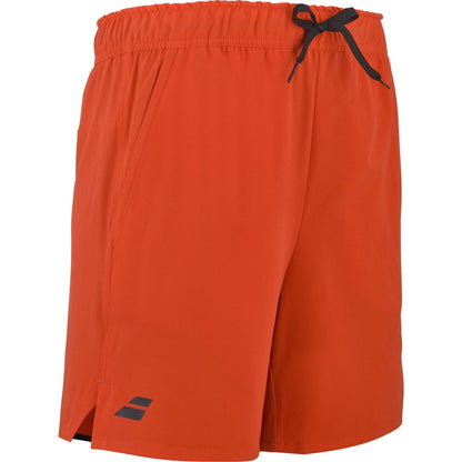 The Babolat Play Men's Padel Shorts in Cherry Tomato feature a black drawstring waistband, side pockets, a small black logo near the left hem, notched side seams, and are made from recycled polyester sports fabric.