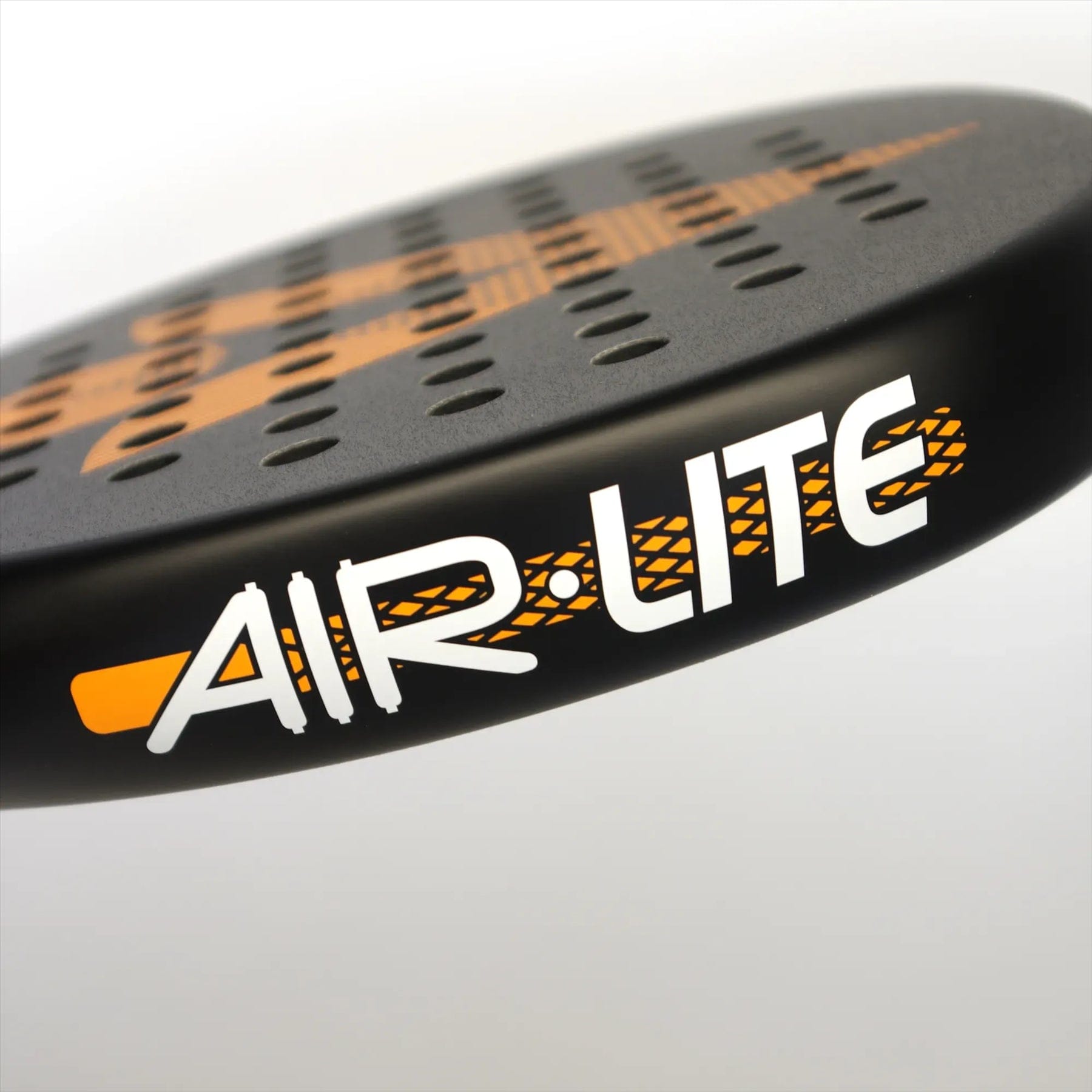 Close-up of the Karakal Air Lite 345 Orange Padel Racket by Karakal, showing its black teardrop shape, perforated holes, orange accents, and "AIR LITE" text in bold white and orange lettering.
