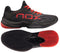 The NOX AT10 Lux Men's Padel Shoes in black and red are shown from the side and bottom. Co-designed with Agustin Tapia, they feature red laces, a bold NOX logo, and a textured sole for superior grip.