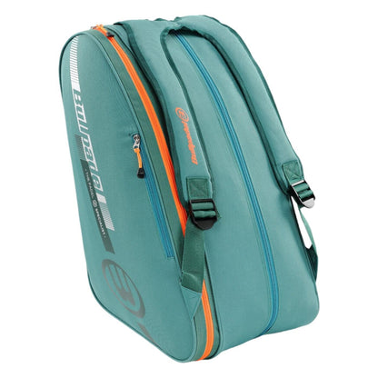 The Bullpadel Tour 25 Padel Racket Bag - Teal by Bullpadel features two main compartments, including a padded racket compartment, adjustable shoulder straps, a printed logo on the side, and a streamlined lightweight design perfect for carrying sports equipment.
