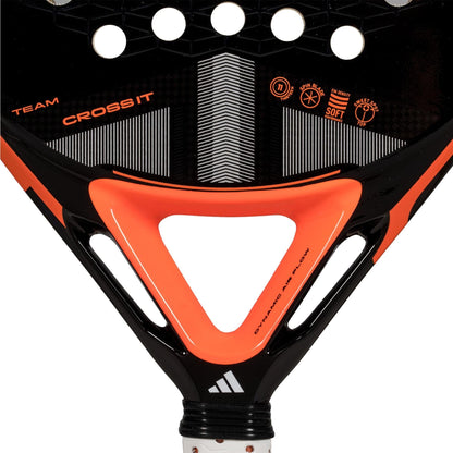 Close-up of the adidas Cross It Team 3.4 Padel Racket, designed for advanced play with a balance of power and control, showcasing geometric patterns, multiple round holes near the top, and a white adidas logo by the handle.