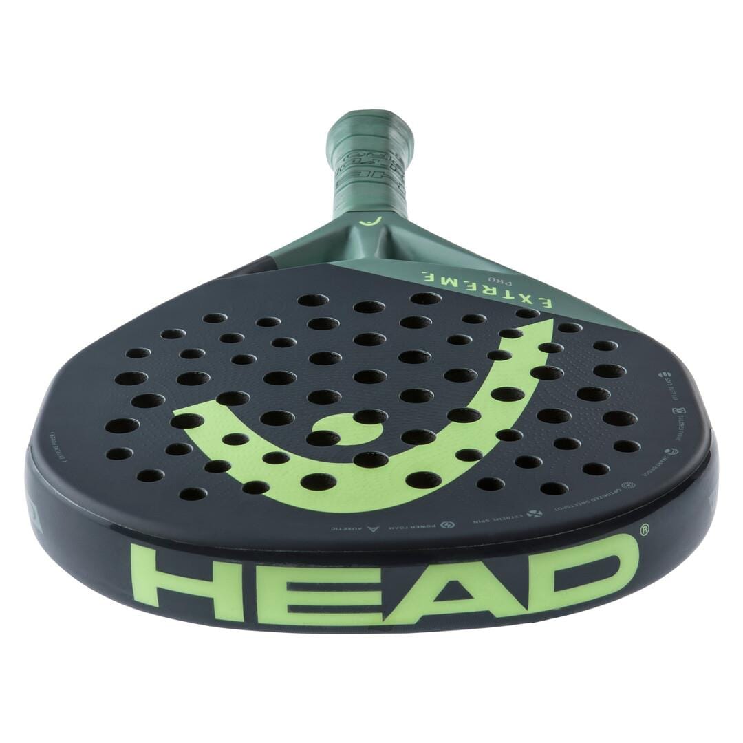 A close-up of the HEAD Extreme Pro 2023 Padel Racket shows its bold green and black design, perforated paddle face, large "HEAD" logo, and “EXTREME” and “PRO” markings for advanced power on the court.