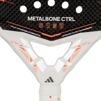 Close-up of the adidas Metalbone Ctrl 2026 padel racket, highlighting "METALBONE CTRL" text, face icons, an innovative adjustable weight system, and a white handle with orange accents featuring the adidas logo.