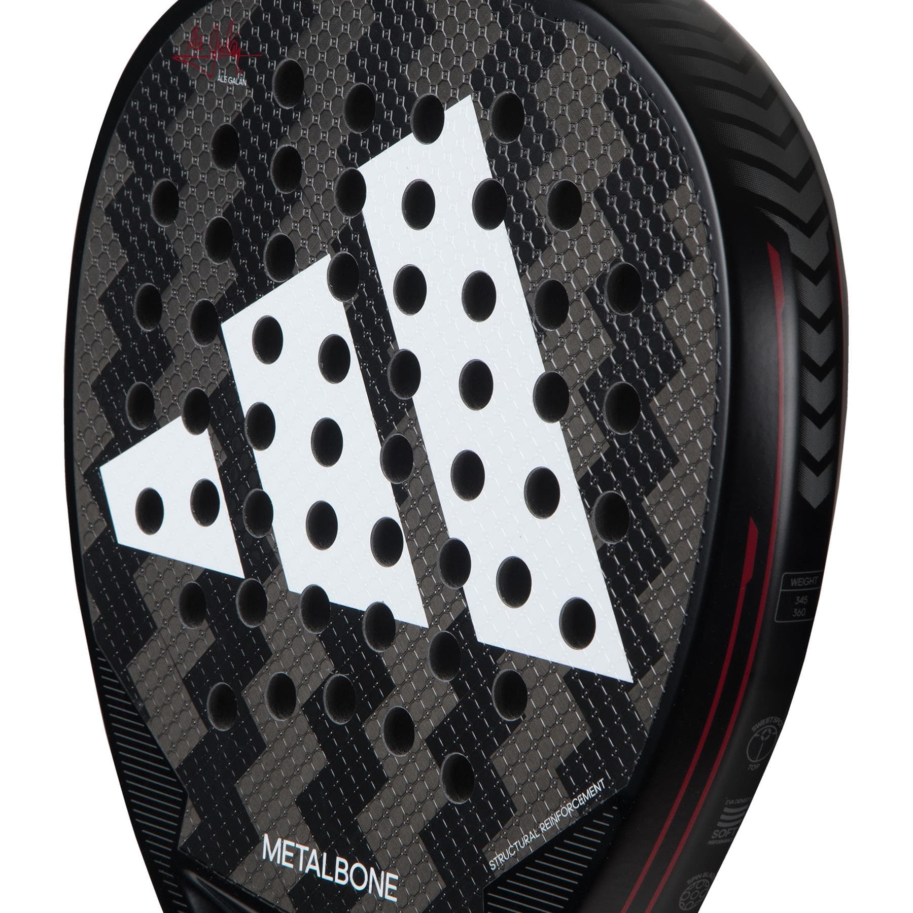 Close-up of the adidas Metalbone 3.3 Padel Racket, featuring a textured carbon fiber surface, circular perforations, white adidas logo, red accents, and adjustable weight design with tread-like edge patterns.