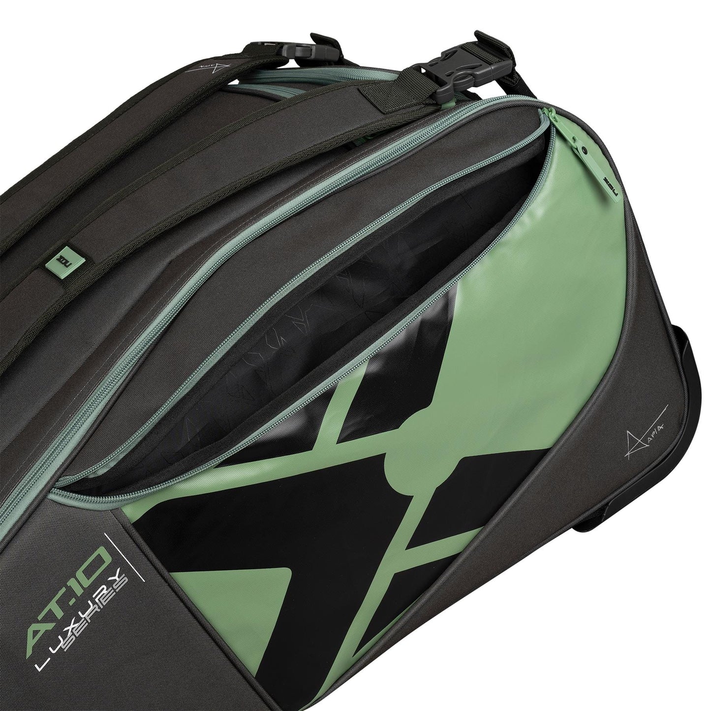 Close-up of the NOX AT10 Competition Trolley Padel Racket Bag by NOX in black and green, featuring a bold graphic, "AT10 Luxury" branding, wheels for easy transport, and a spacious zippered compartment partially open.
