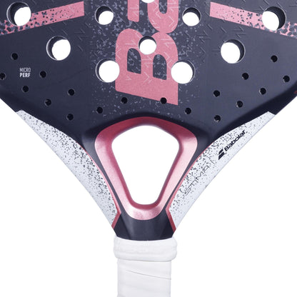Close-up of the Babolat Stima Spirit Padel Racket by Babolat, a lightweight black and pink model with white speckles, triangular throat, round holes, white grip, visible brand logo, and "Micro Perf" text on the surface.